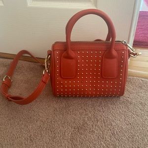 Small red purse, gold studded